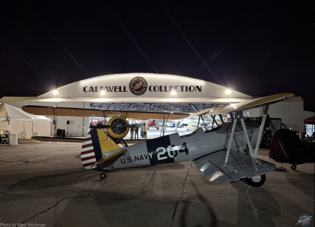 Hangar 3 today at night with a Navy Stearman out front