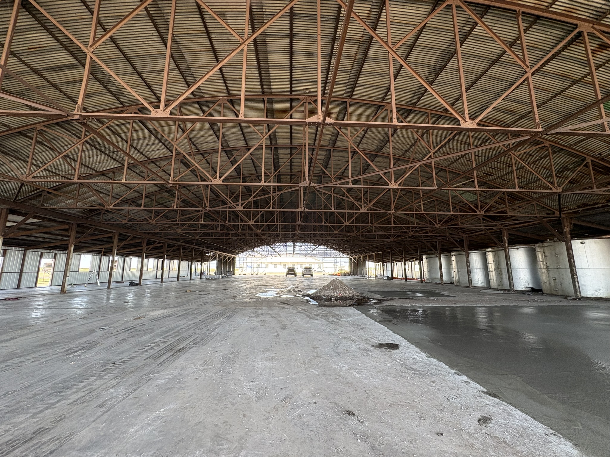Inside the hangar — aircraft lined up on the floor