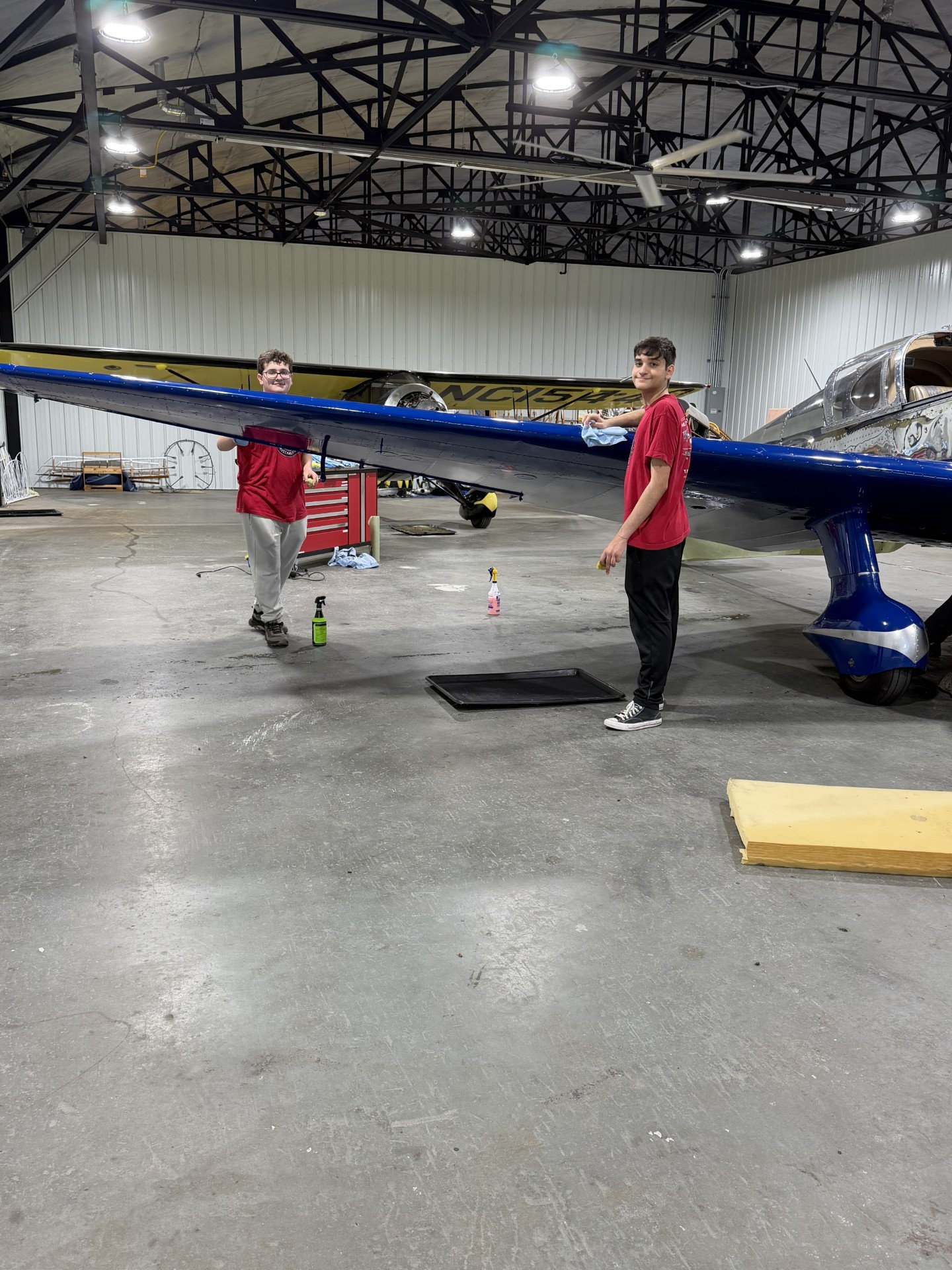 TCC Volunteers polishing the 1938 Ryan SCW